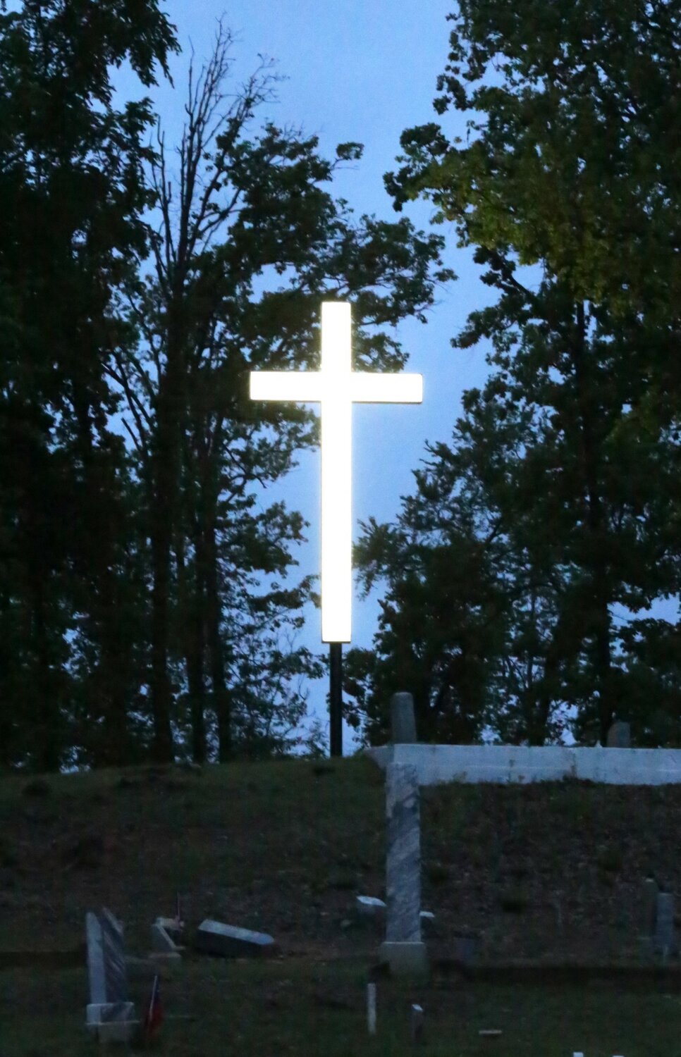 The illuminated cross at Little Mound Church